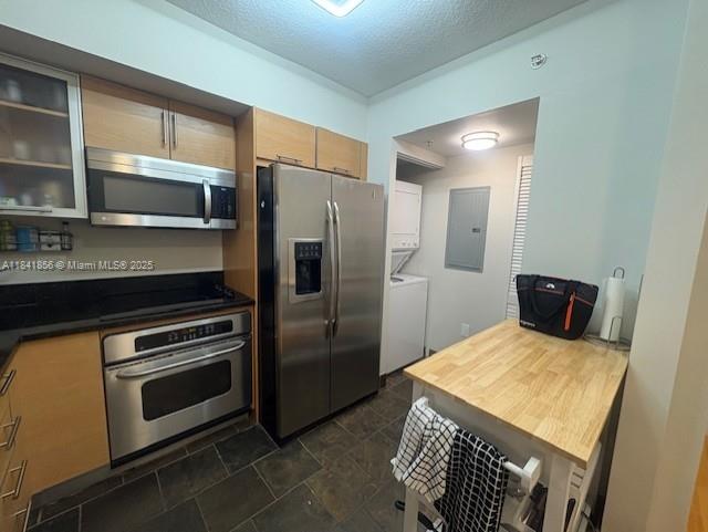Brickell on the River Miami, FL 33131 - Photo 5 of 12 a kitchen with stainless steel appliances a stove a microwave and a refrigerator