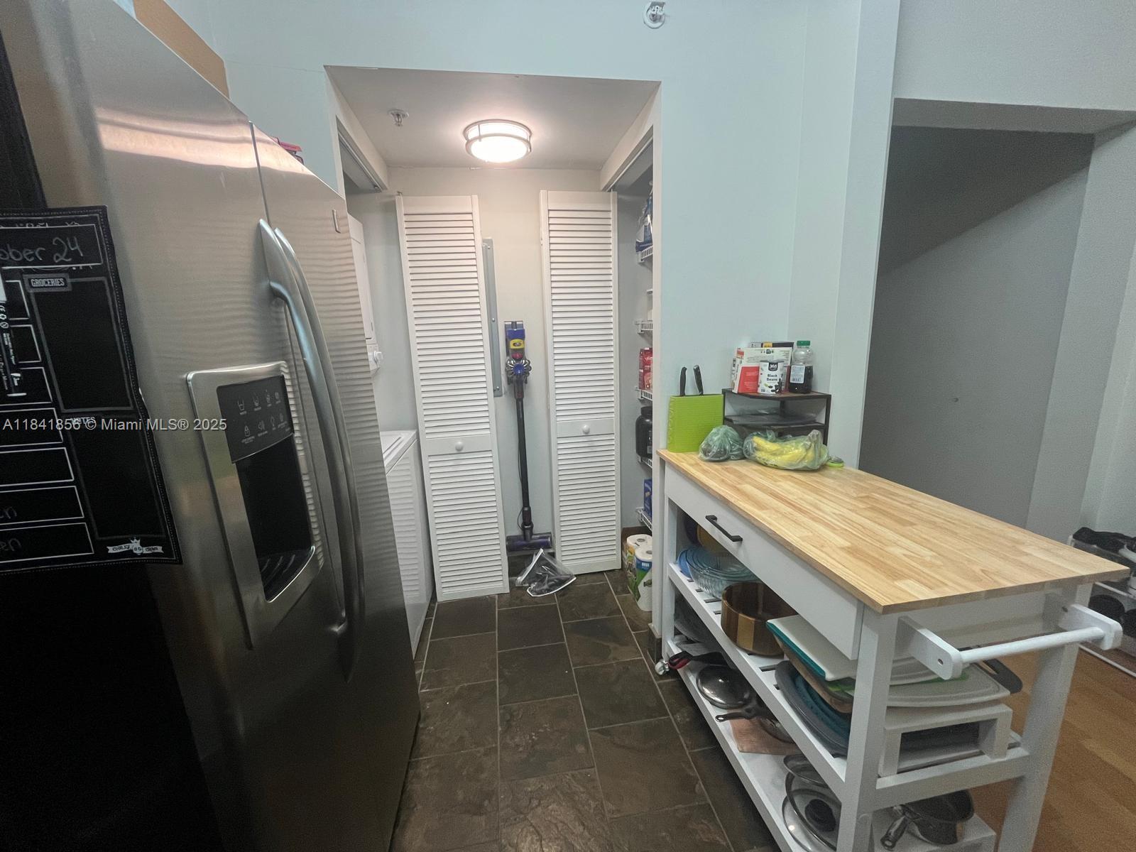 Brickell on the River Miami, FL 33131 - Photo 6 of 12 a room with a washer and dryer