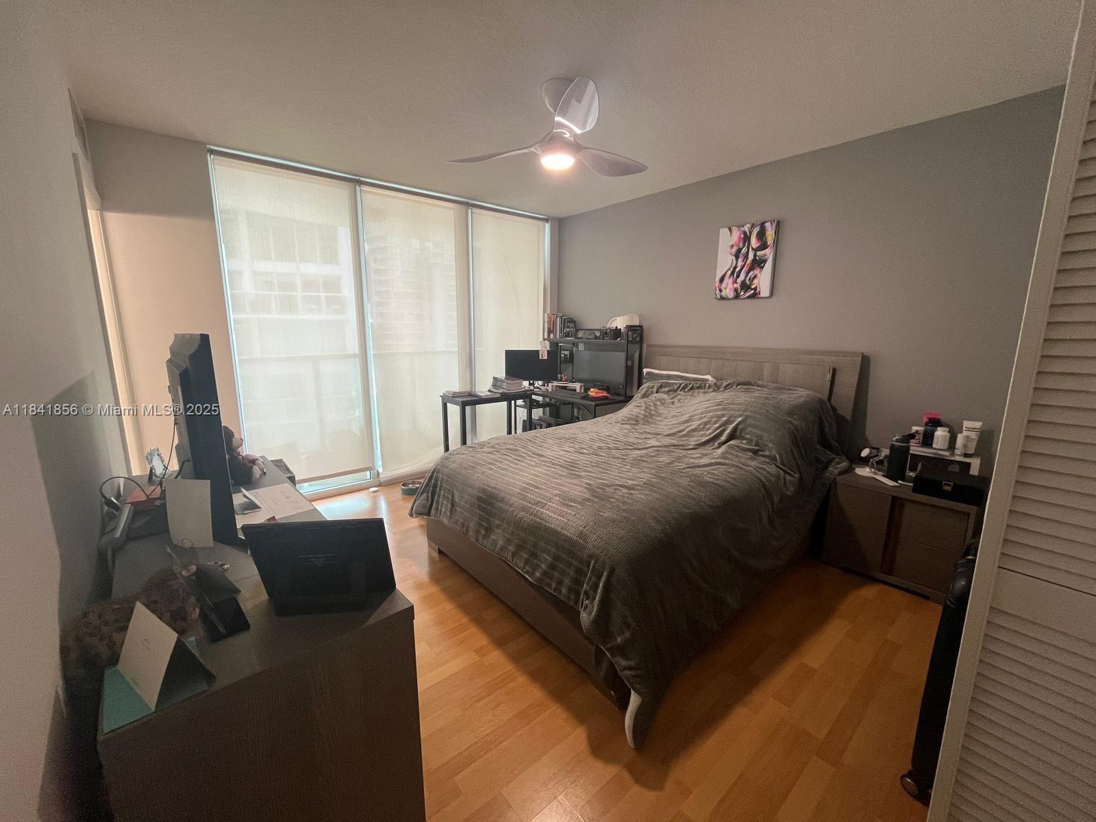 Brickell on the River Miami, FL 33131 - Photo 7 of 12 a bed room with a bed and a couch