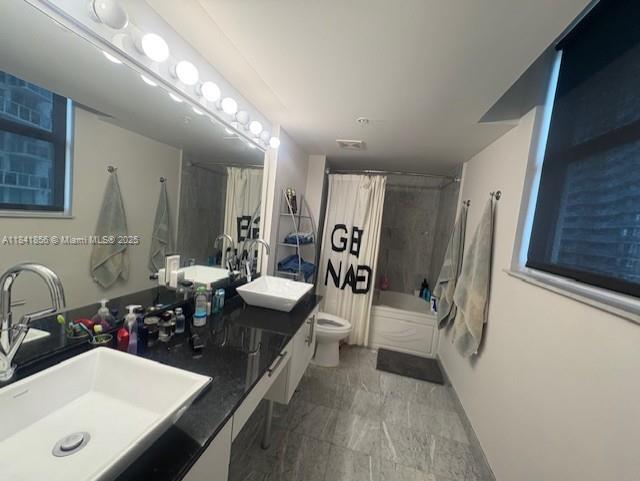 Brickell on the River Miami, FL 33131 - Photo 8 of 12 a bathroom with a sink double vanity granite tub shower and mirror