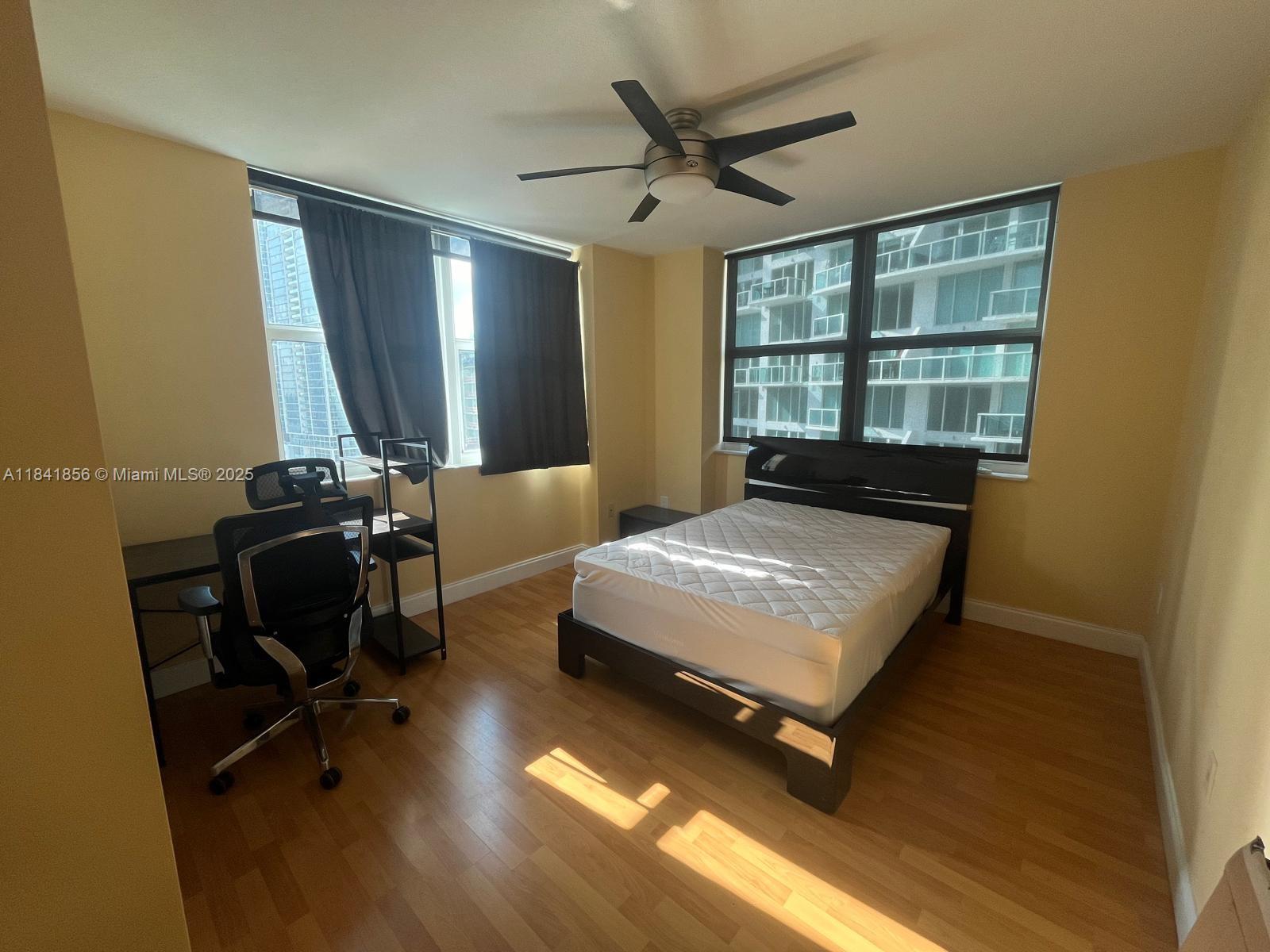 Brickell on the River Miami, FL 33131 - Photo 10 of 12 a bedroom with a bed and window