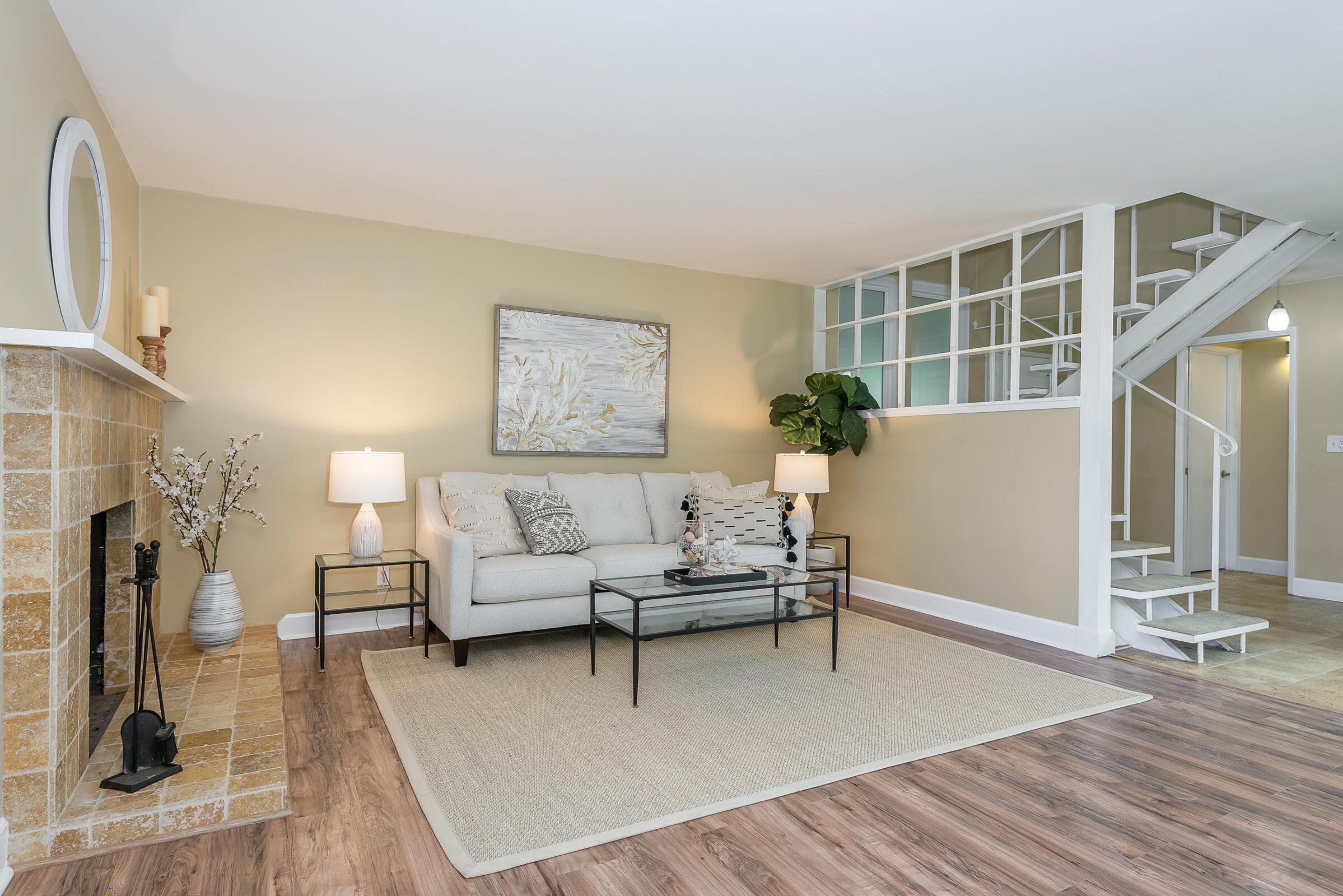 847 Cieneguitas Road Santa Barbara, CA 93110 - Photo 3 of 15 a living room with furniture and a fireplace