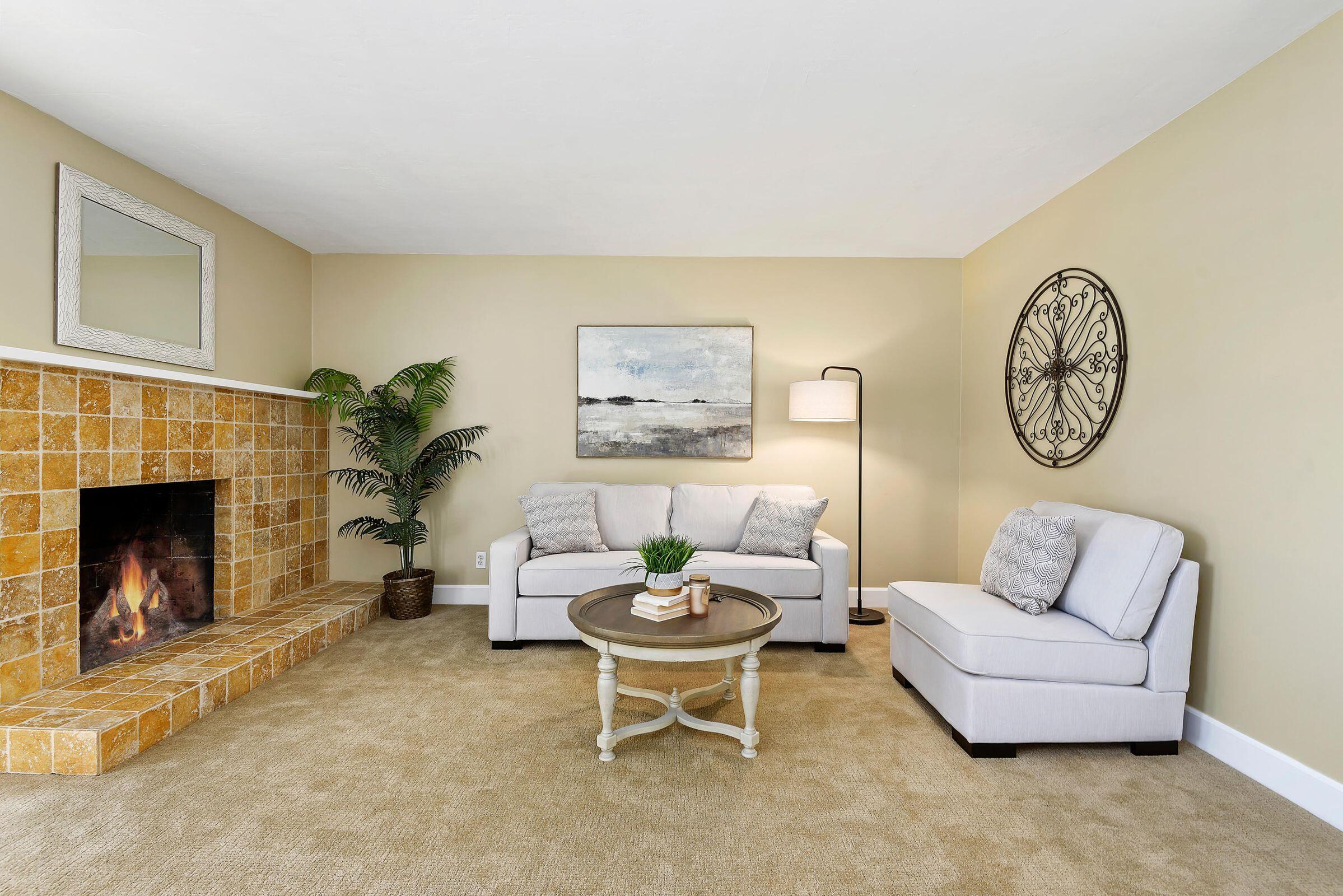 847 Cieneguitas Road Santa Barbara, CA 93110 - Photo 7 of 15 a living room with furniture a fireplace and a window