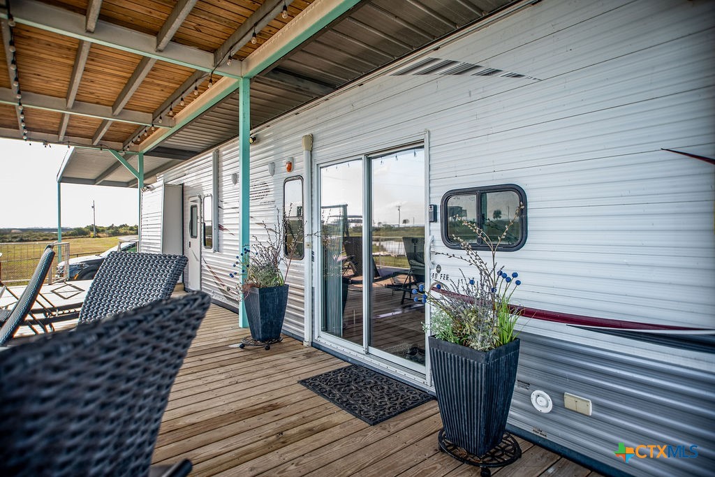 305 Zimmerman Road Port Lavaca, TX 77979 - Photo 12 of 33 a view of a porch with furniture