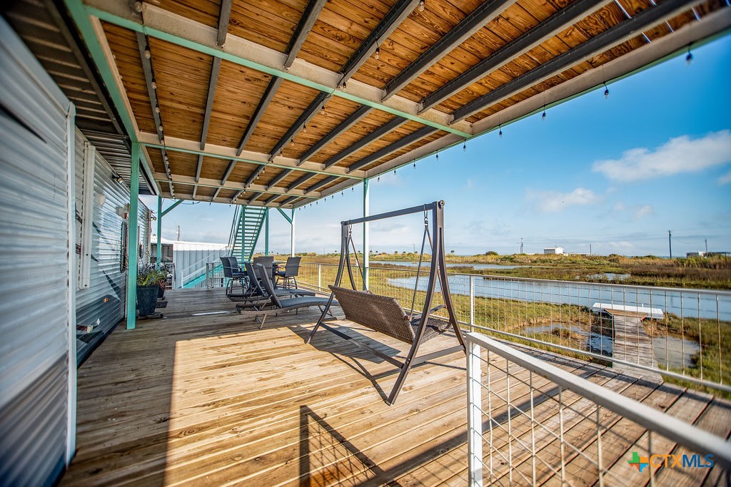 305 Zimmerman Road Port Lavaca, TX 77979 - Photo 15 of 33 a view of a balcony with chairs and wooden floor