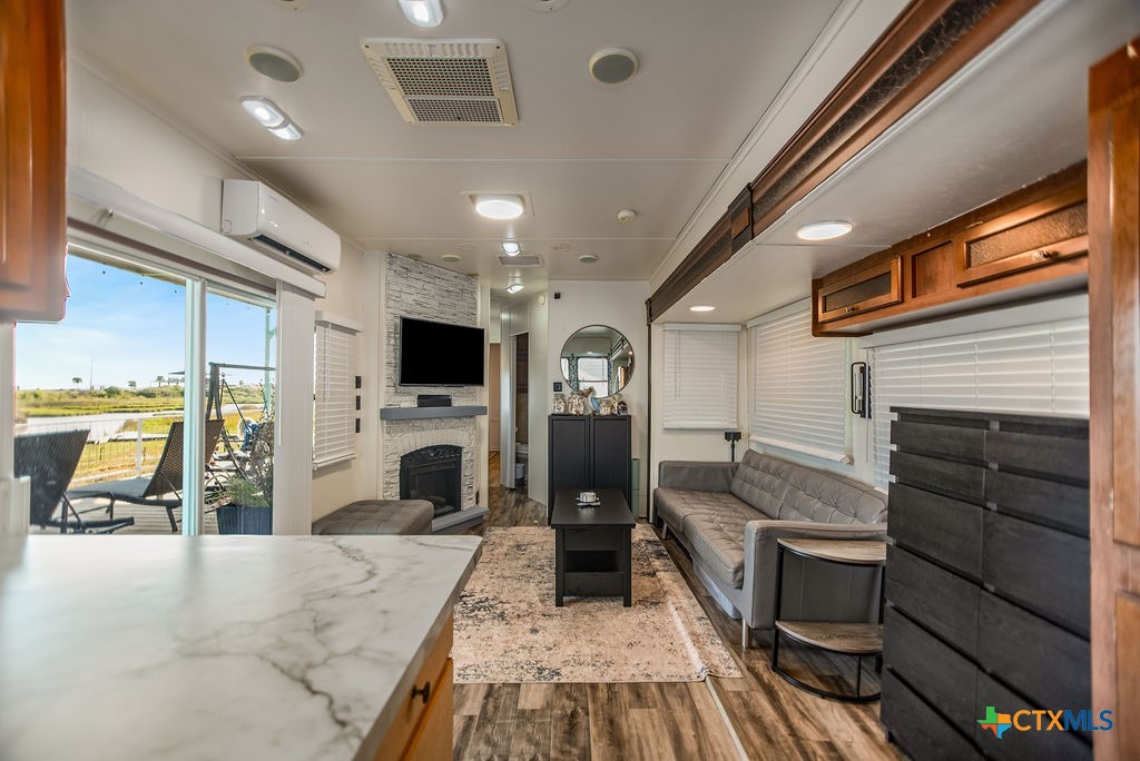 305 Zimmerman Road Port Lavaca, TX 77979 - Photo 18 of 33 a living room with furniture and a fireplace