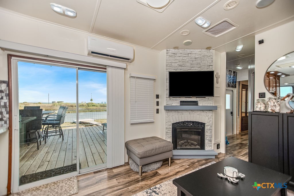 305 Zimmerman Road Port Lavaca, TX 77979 - Photo 20 of 33 a living room with furniture a flat screen tv and a fireplace