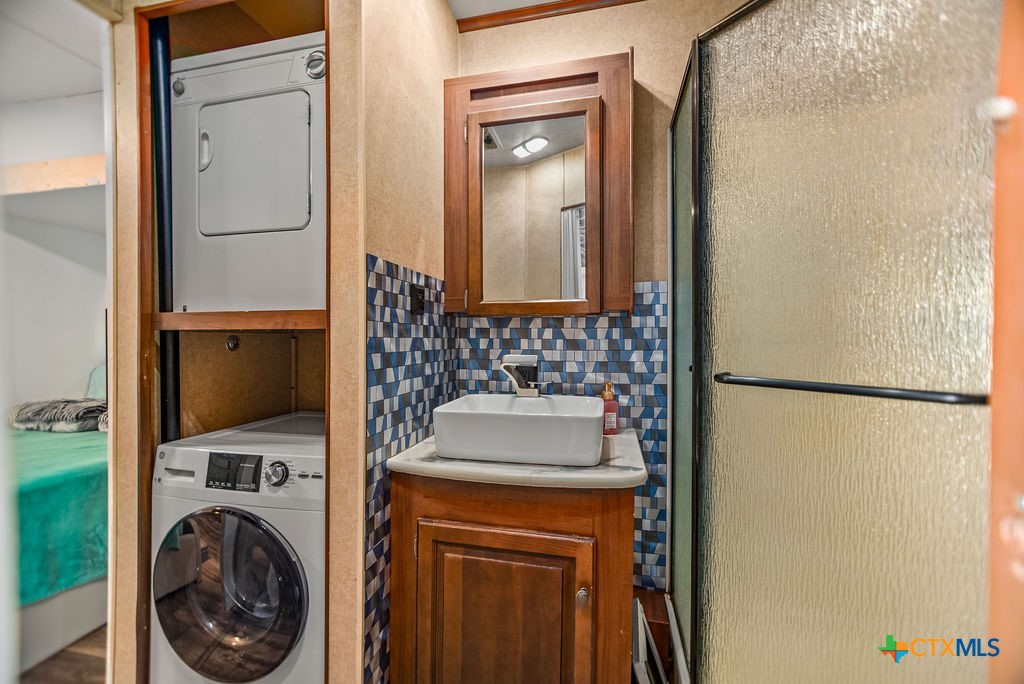 305 Zimmerman Road Port Lavaca, TX 77979 - Photo 22 of 33 a bathroom with a sink a toilet and shower