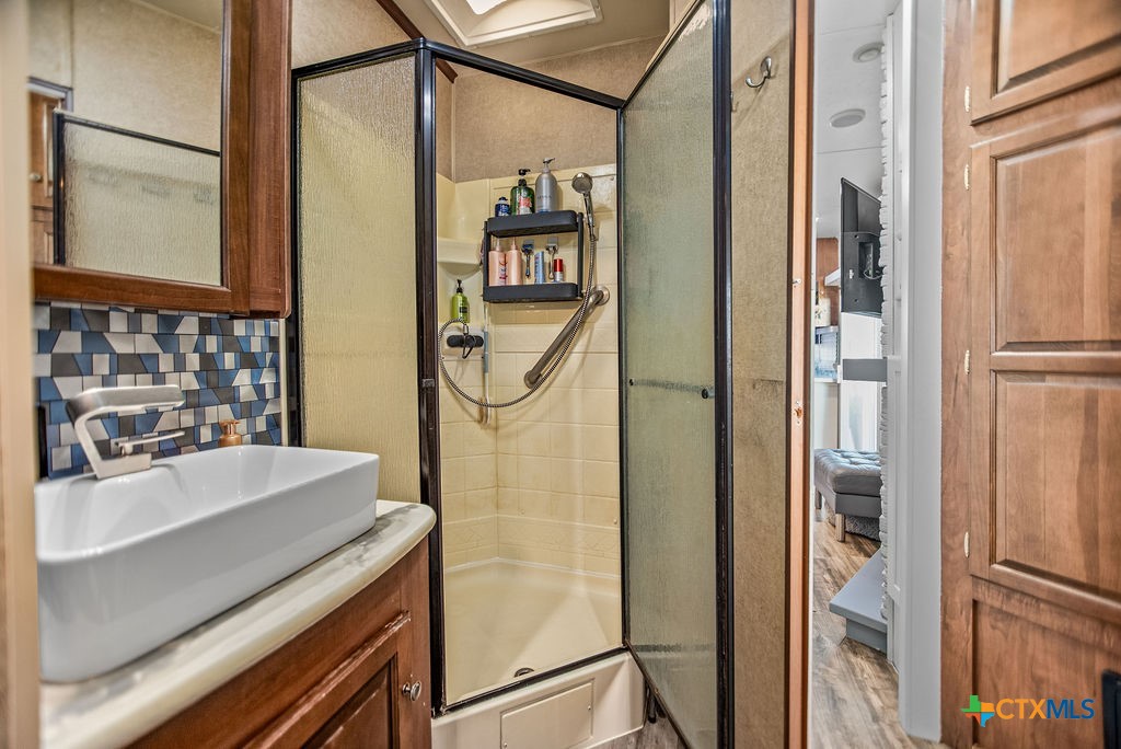 305 Zimmerman Road Port Lavaca, TX 77979 - Photo 23 of 33 a bathroom with a sink and a mirror