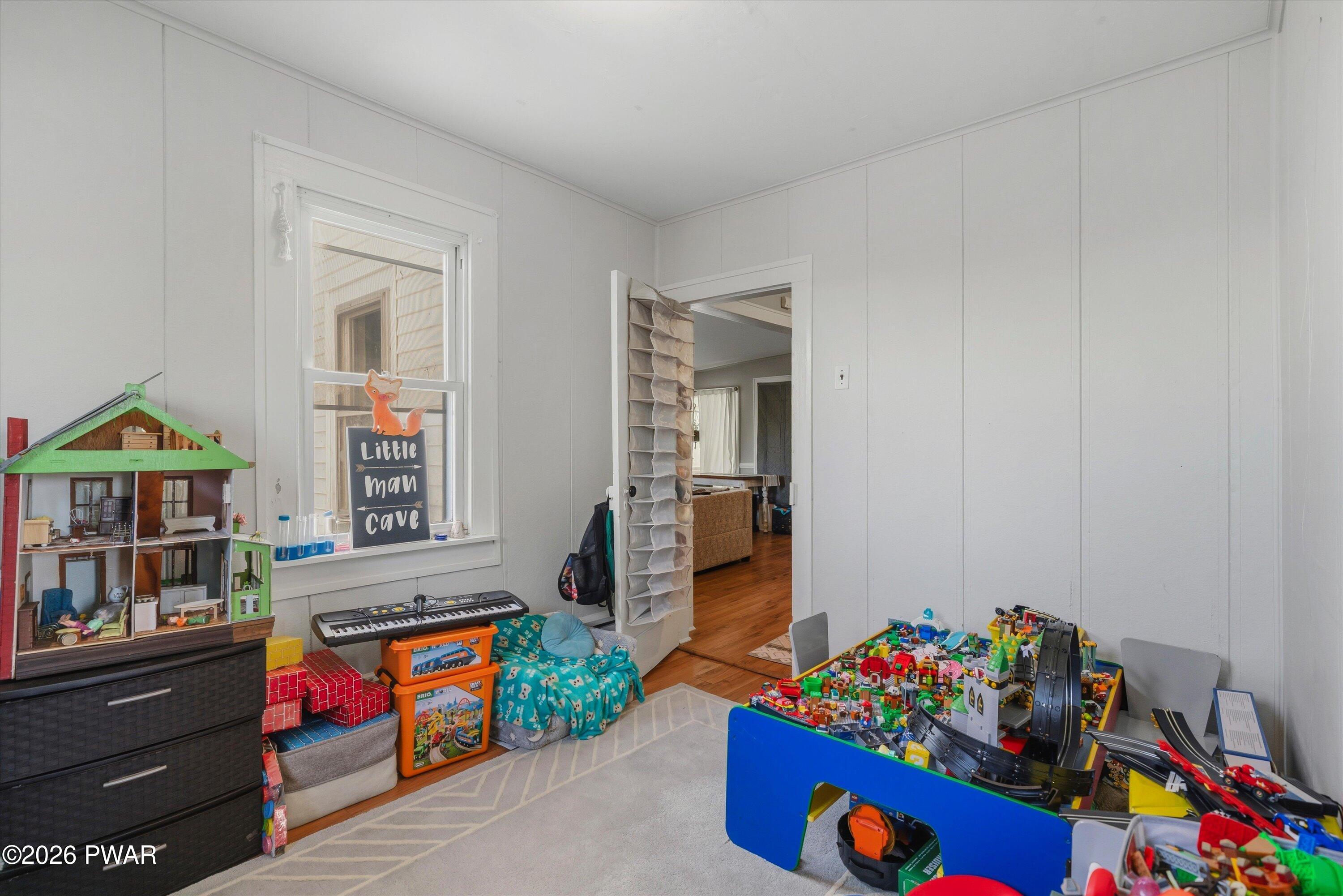 127 Valleyview Road Greentown, PA 18426 - Photo 34 of 66 a living room with furniture toys and a baby crib