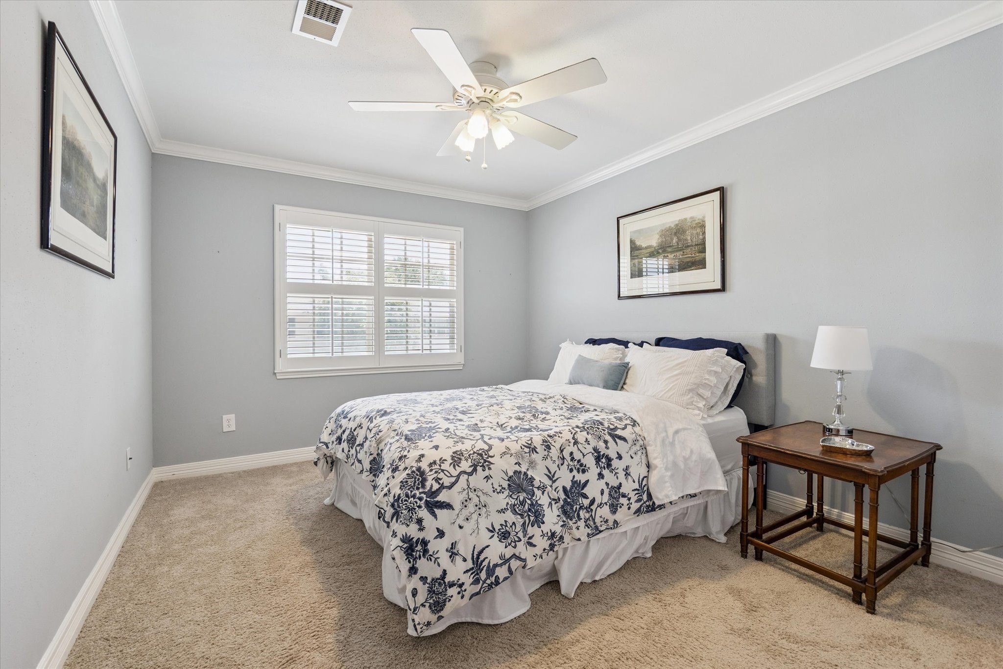 5842 Doliver Drive, Unit 47 Houston, TX 77057 - Photo 16 of 24 Another guest room featuring the same plantation shutters on the large window.