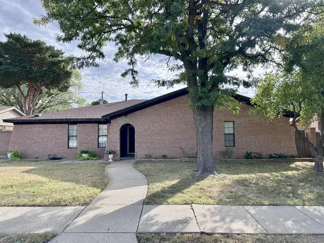 a view of a kitchen from a hallway