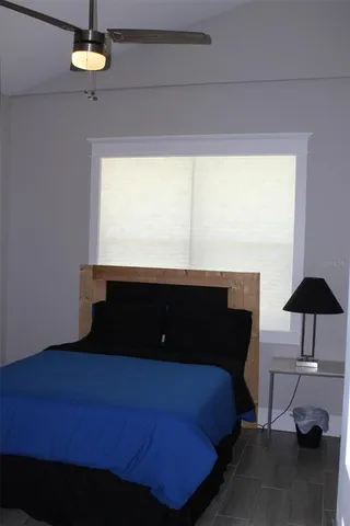 a bedroom with a bed and a table