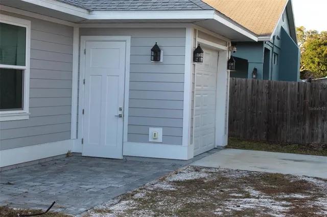 a view of front door and yard