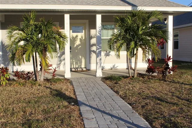 a view of a backyard of the house