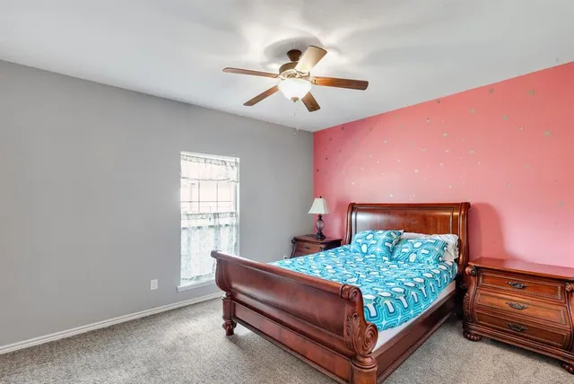 a bed room with a bed and a window