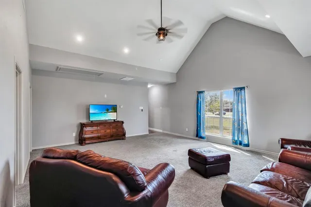 a bedroom with furniture and a window