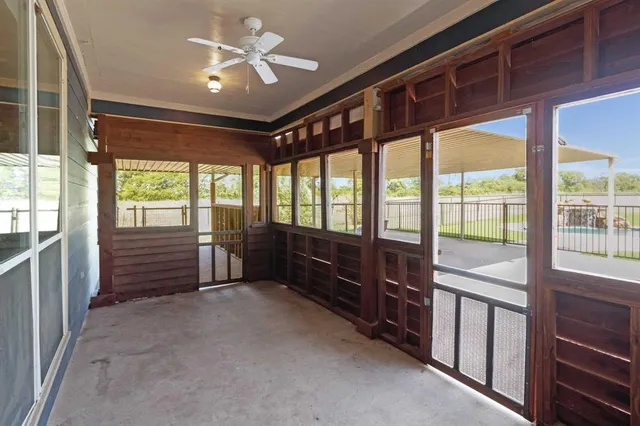 a view of an empty room with a balcony