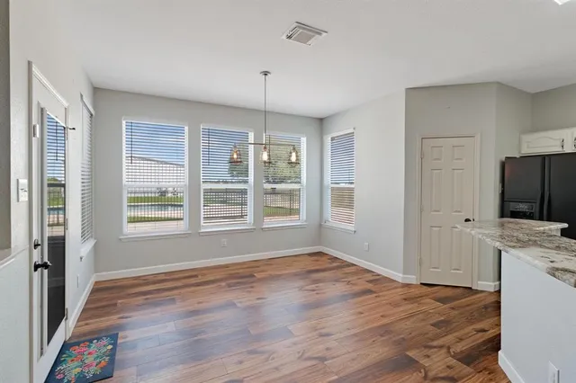 a view of livingroom with hardwood floor and a ceiling fan