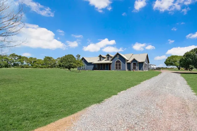 a view of a house with a big yard