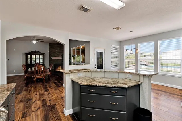 a kitchen with a table chairs and a stove