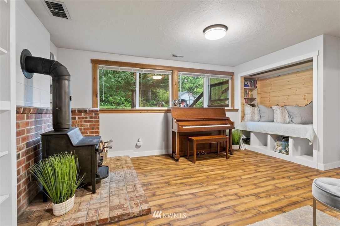 5680 Northeast Foster Road Bainbridge Island, WA 98110 - Photo 13 of 23 a room with furniture and a large window