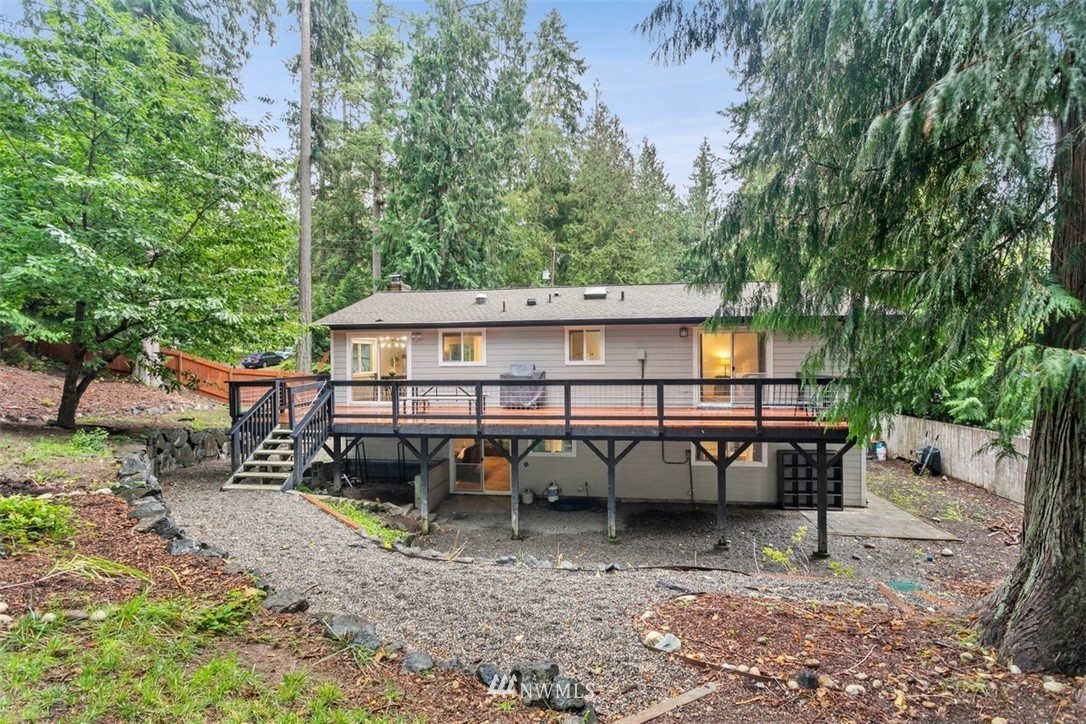 5680 Northeast Foster Road Bainbridge Island, WA 98110 - Photo 20 of 23 a view of a chair and table on the deck