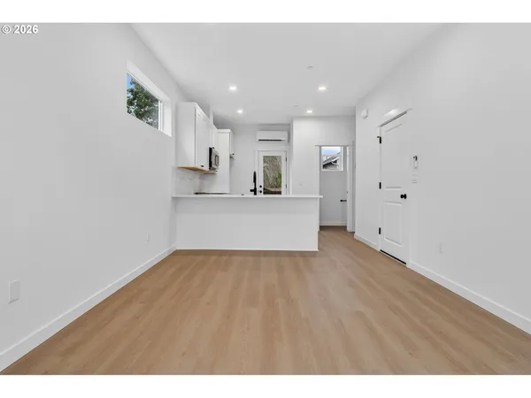 a view of an empty room with a window