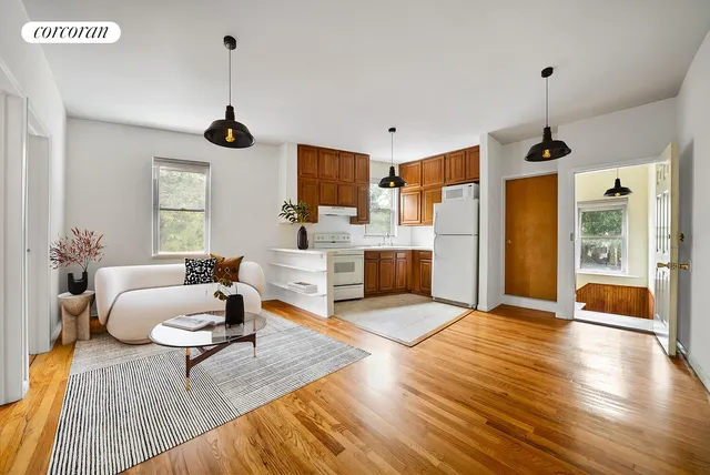 a front view of a house with a yard and a garage