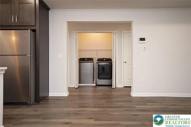a view of a kitchen from the hallway