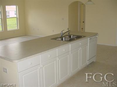 3111 35th Street Southwest Lehigh Acres, FL 33976 - Photo 2 of 10 a bathroom with a sink and a mirror