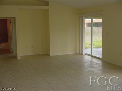 3111 35th Street Southwest Lehigh Acres, FL 33976 - Photo 4 of 10 a view of an empty room with windows