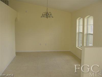 3111 35th Street Southwest Lehigh Acres, FL 33976 - Photo 6 of 10 an empty room with windows