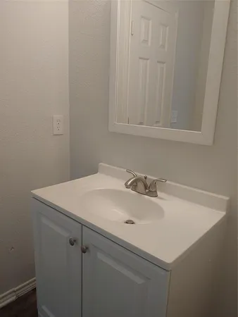 a bathroom with a sink and vanity