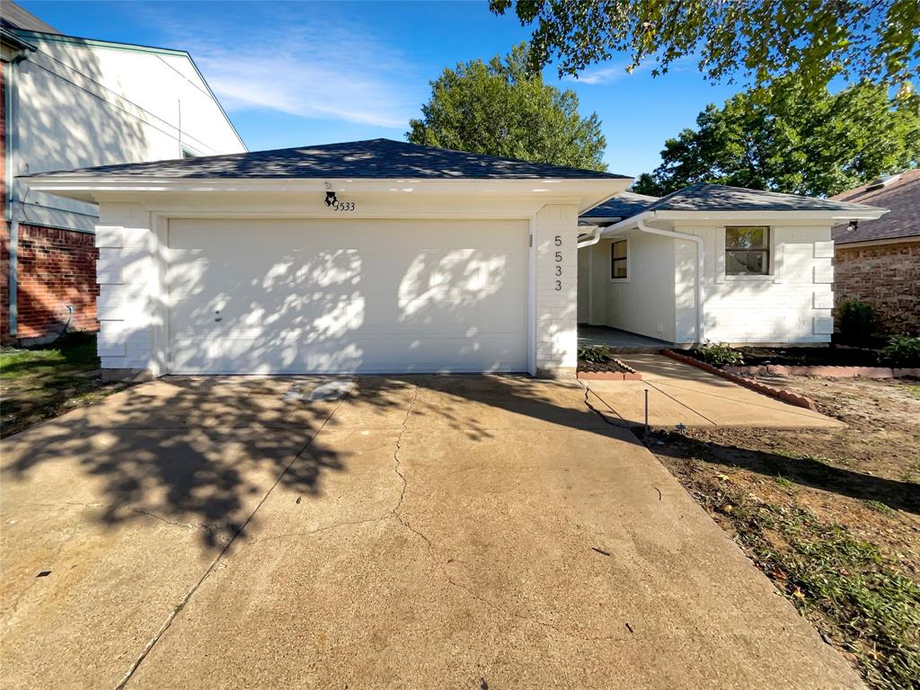 a view of a house with a snow in the yard