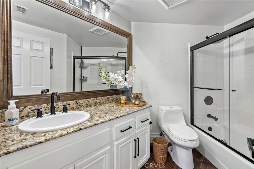 1926 Kleck Road Paso Robles, CA 93446 - Photo 13 of 29 a bathroom with a granite countertop sink a toilet a mirror and shower