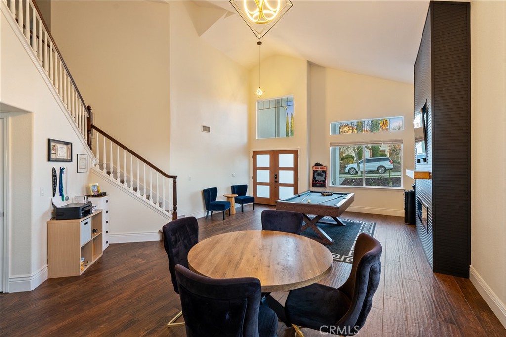 1926 Kleck Road Paso Robles, CA 93446 - Photo 6 of 29 a dining room with wooden floor a chandelier a glass table and chairs