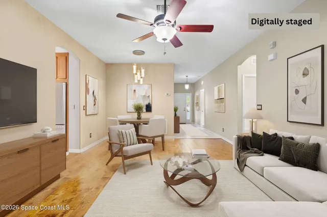 a bedroom with furniture and a flat screen tv