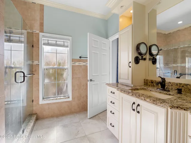 a view of a lake with houses in the back