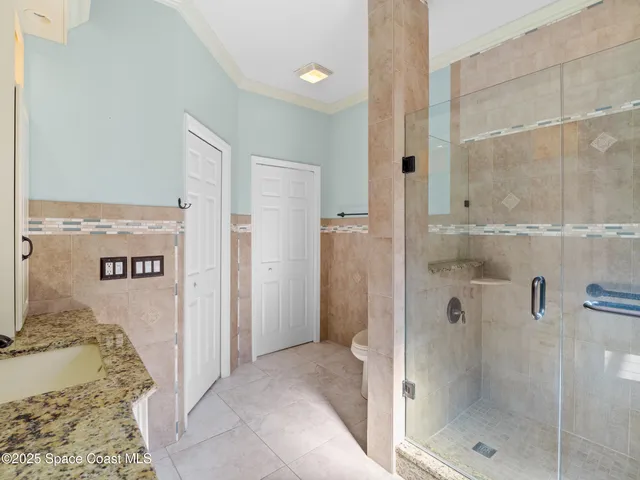 an aerial view of a house with a garden and yard