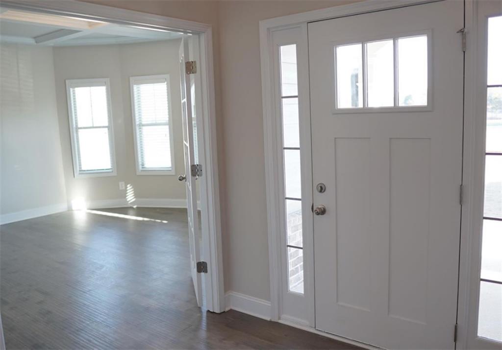 309 Bermuda Ridge Perry, GA 31069 - Photo 13 of 33 an empty room with wooden floor and windows