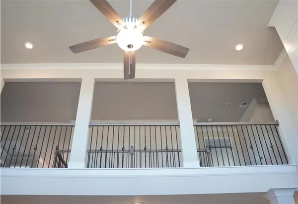 a view of an empty room with window and fireplace