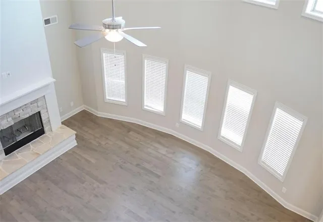 a view of kitchen with granite countertop cabinets and sink