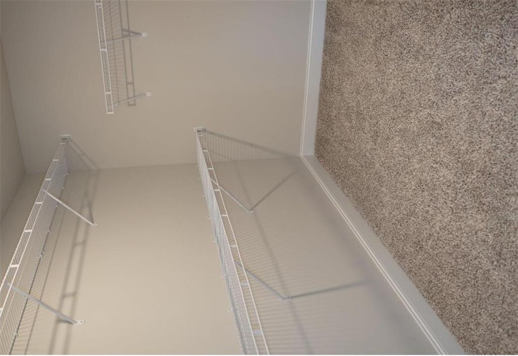 309 Bermuda Ridge Perry, GA 31069 - Photo 19 of 33 a view of staircase with railing and white walls