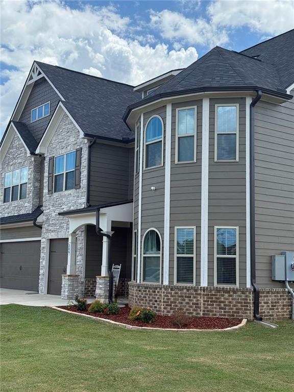 309 Bermuda Ridge Perry, GA 31069 - Photo 3 of 33 a front view of a house with a yard