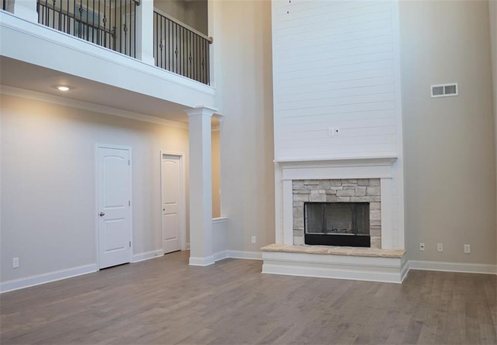 309 Bermuda Ridge Perry, GA 31069 - Photo 10 of 33 a view of an empty room with fireplace and a window