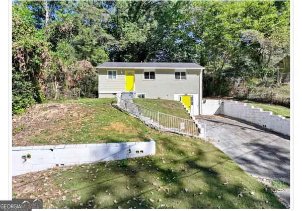a view of a backyard with table and chairs with wooden fence