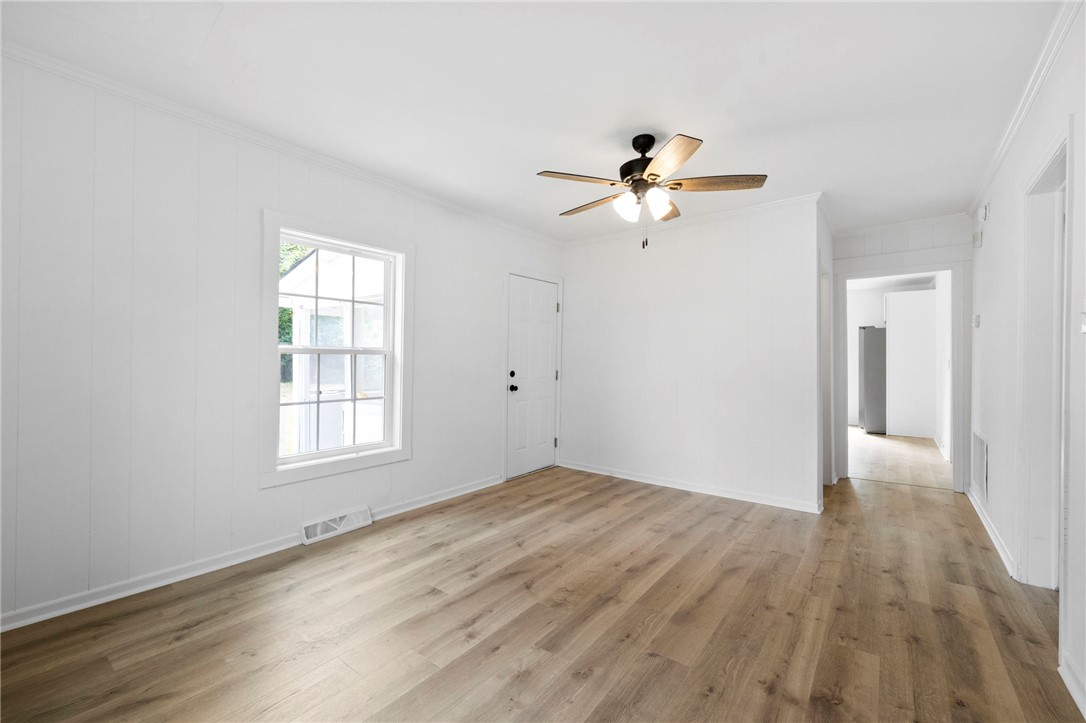 201 South 8th Street Easley, SC 29640 - Photo 17 of 28 Rich wood floors lay a beautiful foundation beneath clean paneled walls and classic multi-pane windows.