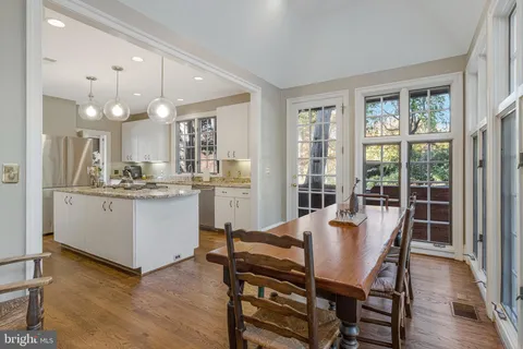 a living room with furniture large window and a fireplace