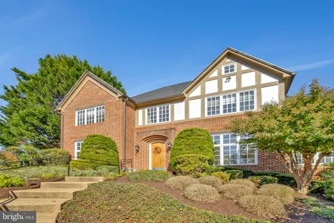 a hallway with furniture and wooden floor